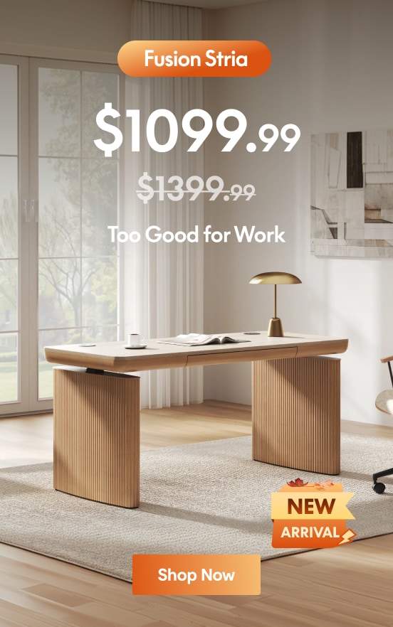 Modern wooden office desk with ribbed panel legs, priced at $999.99, featuring a "New Arrival" badge and text "Too Good for Work" in a bright, minimalist room.