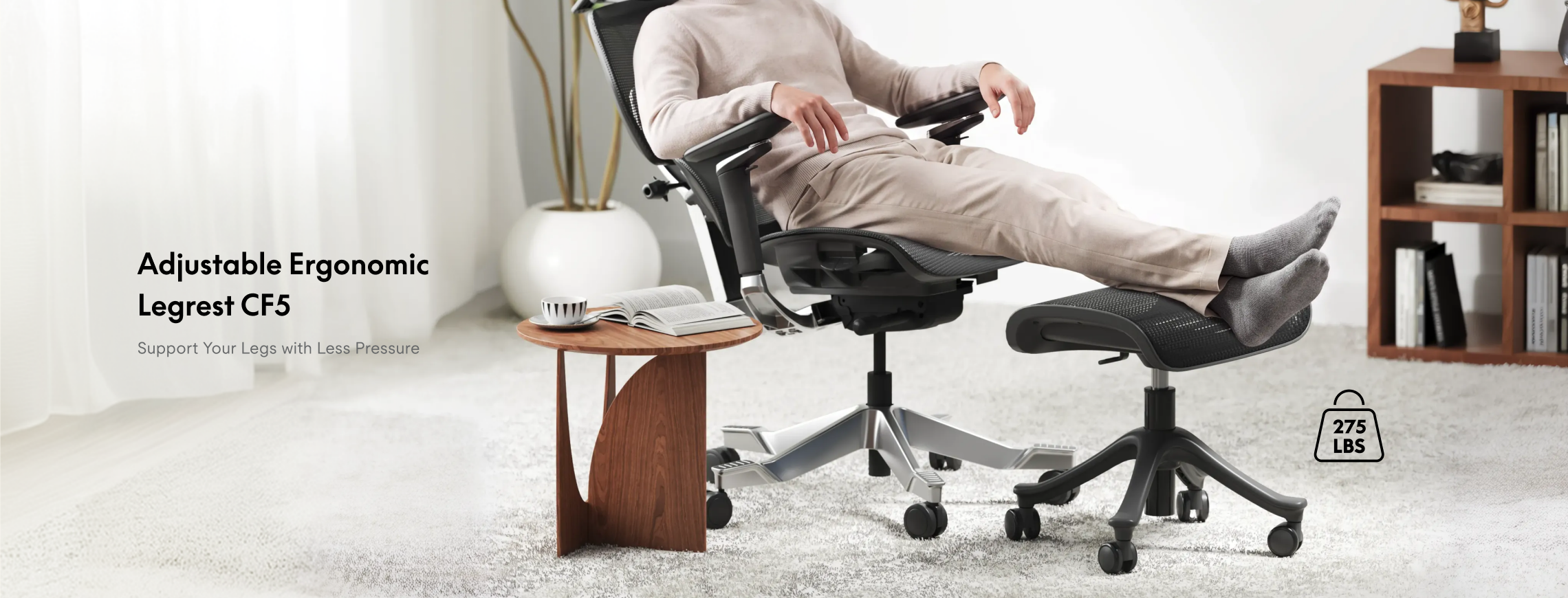 FlexiSpot CF5 ergonomic footrest supporting a man’s legs while he reclines comfortably in an office chair at home