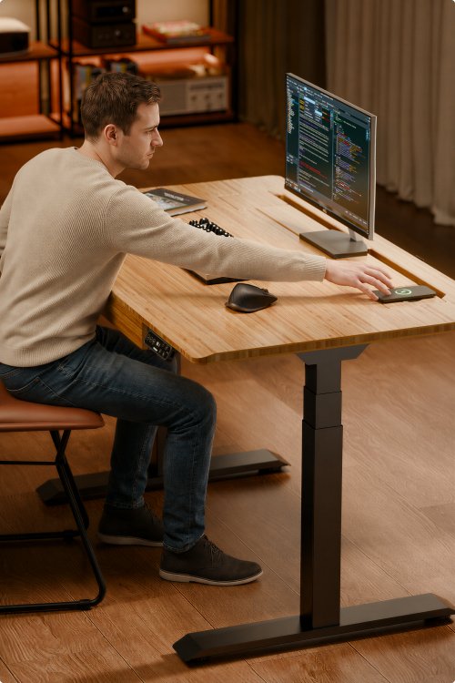 Workstation scene, using wireless charging on E7 Hive electric standing desk