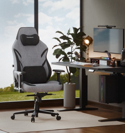 A GC7 gaming chair in front view in a bright workspace by a large window