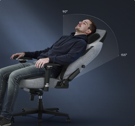 A man relaxing in the FlexiSpot GC7 gaming chair, demonstrating its 90°-155° recline range