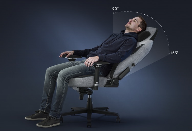 A man relaxing in the GC7 gaming chair, showing its 90-155° deep recline feature.