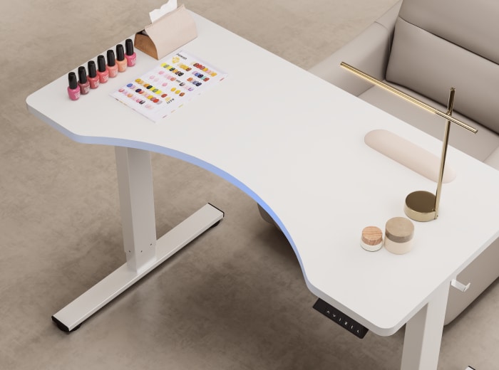 Curved manicure tabletop detail view with nail art supplies for nail salon