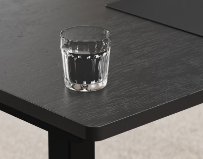 Wood veneer tabletop close‑up, crack‑resistant, moisture‑proof and scratch‑resistant surface with water glass demo