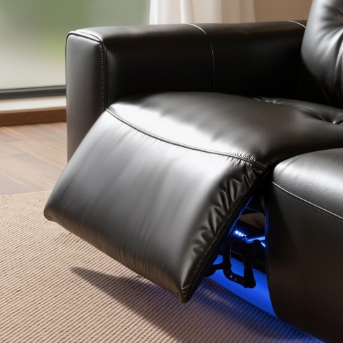 Ambient lighting creates a home theater  atmosphere around a power reclining sofa