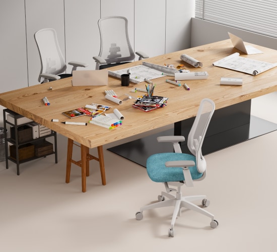A spacious office with a large wooden table cluttered with papers, markers, and stationery, surrounded by modern chairs.