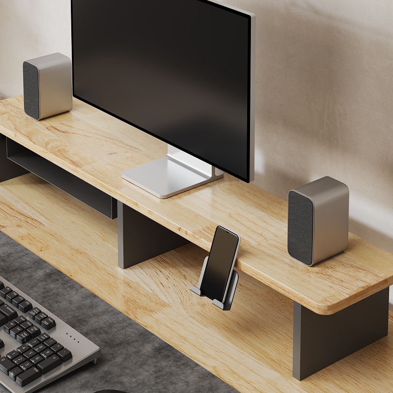 Wooden desktop monitor stand with storage space, holding a monitor, two gray speakers, and a smartphone in a black holder.